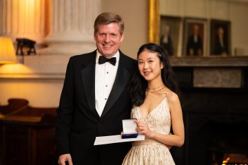 Award winner posing with award medal